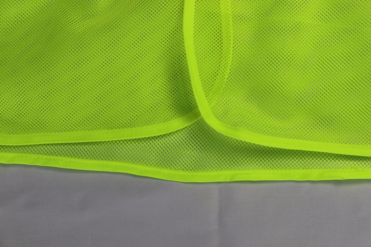 Bright banana-colored mesh reflective vest with two elastic sides and 5cm striped orange reflective materia